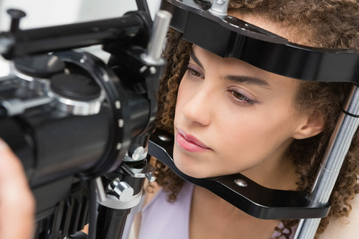 Woman doing eye test in medical office