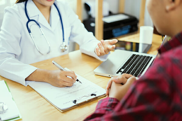 Women Doctors and patient are discussing something ,Having Consultation,